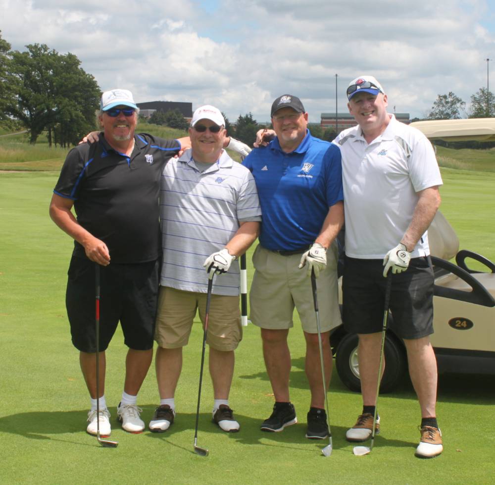 same four men playing golf